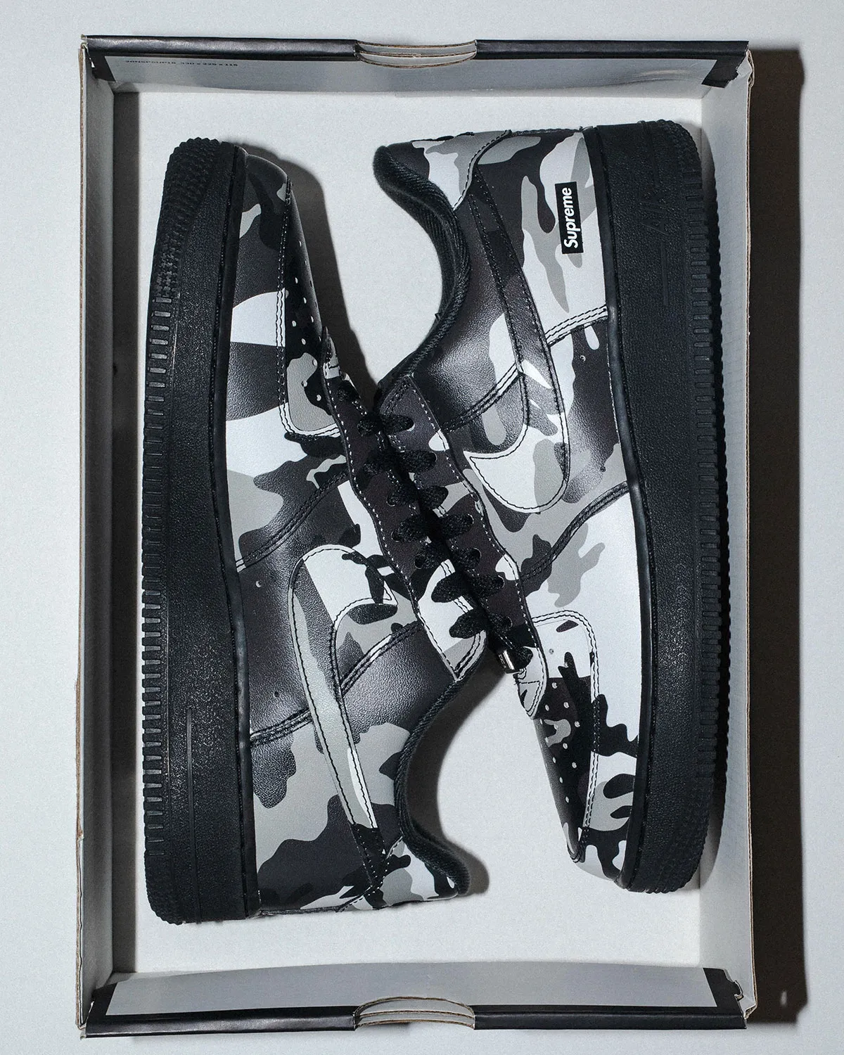 Supreme x Nike Air Force 1 Snow Camo top-down in box